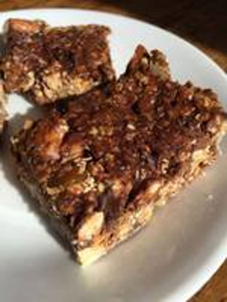 A close up of Tosteds granola bars on a plate.