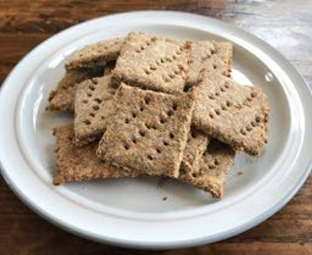 A white plate stacked with Tosteds crackers